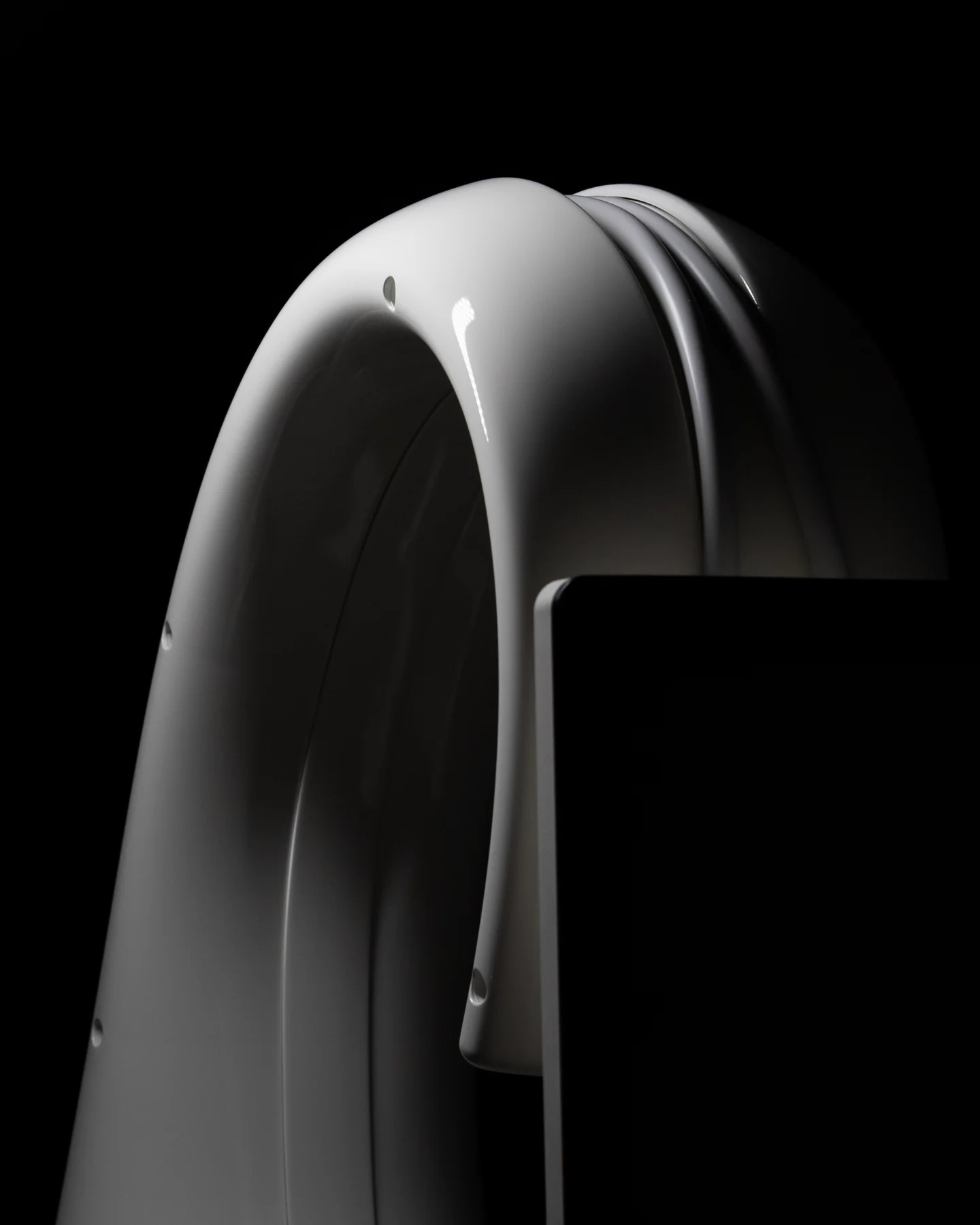 The arched top of the T-Shape 2 platform, lit against black.
